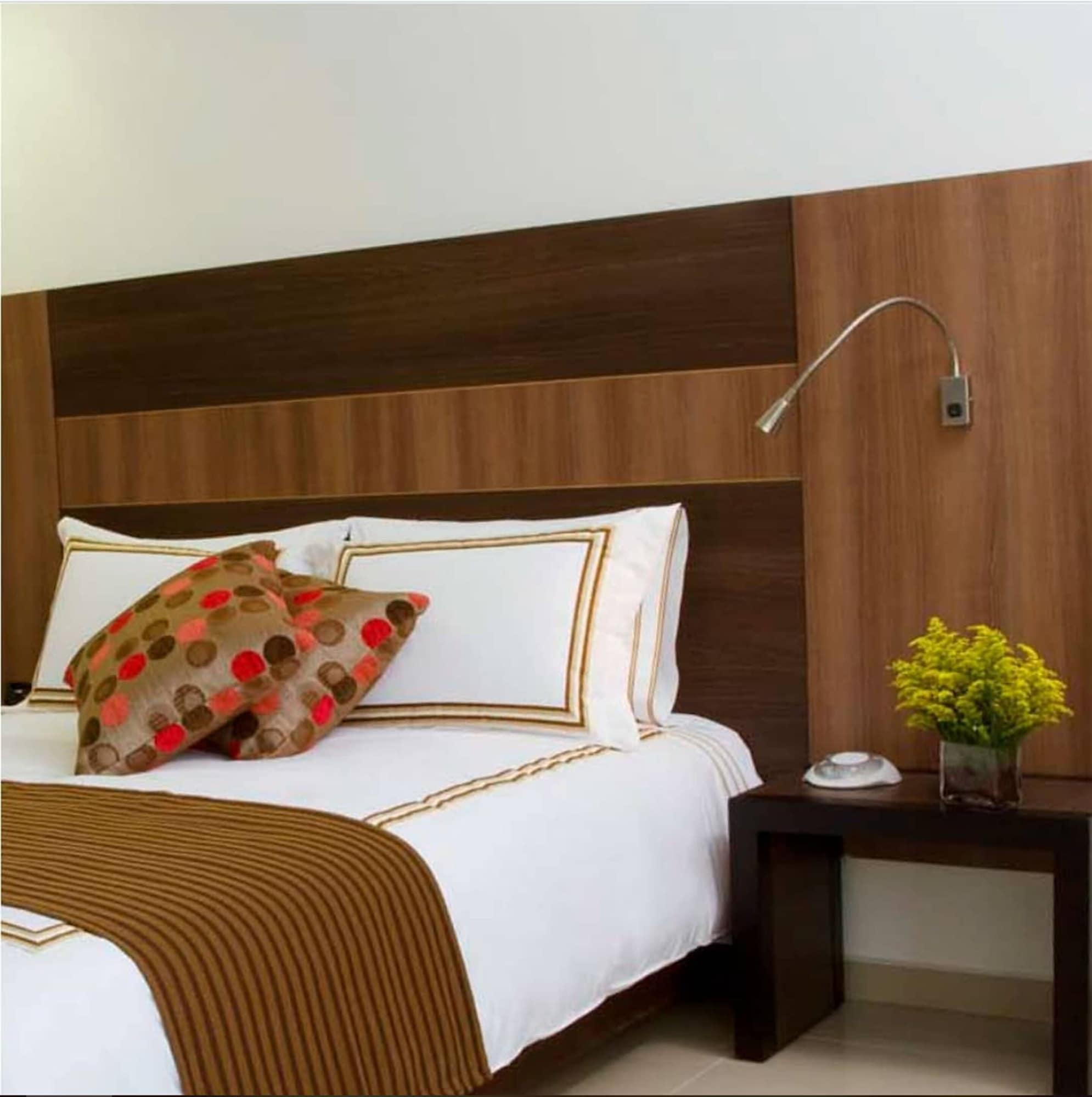 San Simon Hotel Pereira By Soratama Extérieur photo A wall mounted reading light