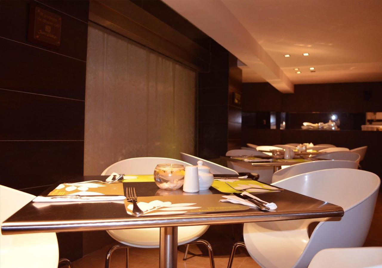 San Simon Hotel Pereira By Soratama Extérieur photo The interior of the restaurant