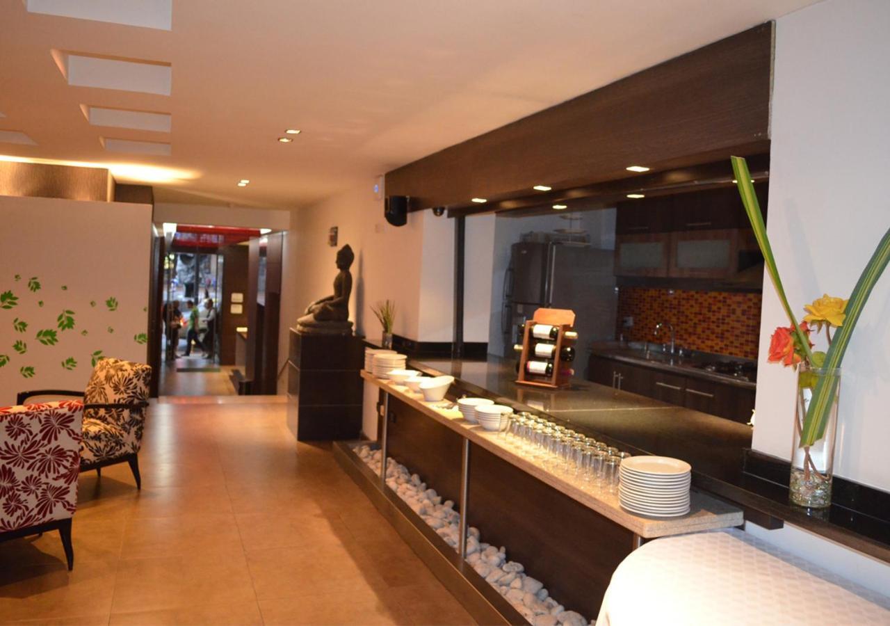 San Simon Hotel Pereira By Soratama Extérieur photo The interior of the restaurant